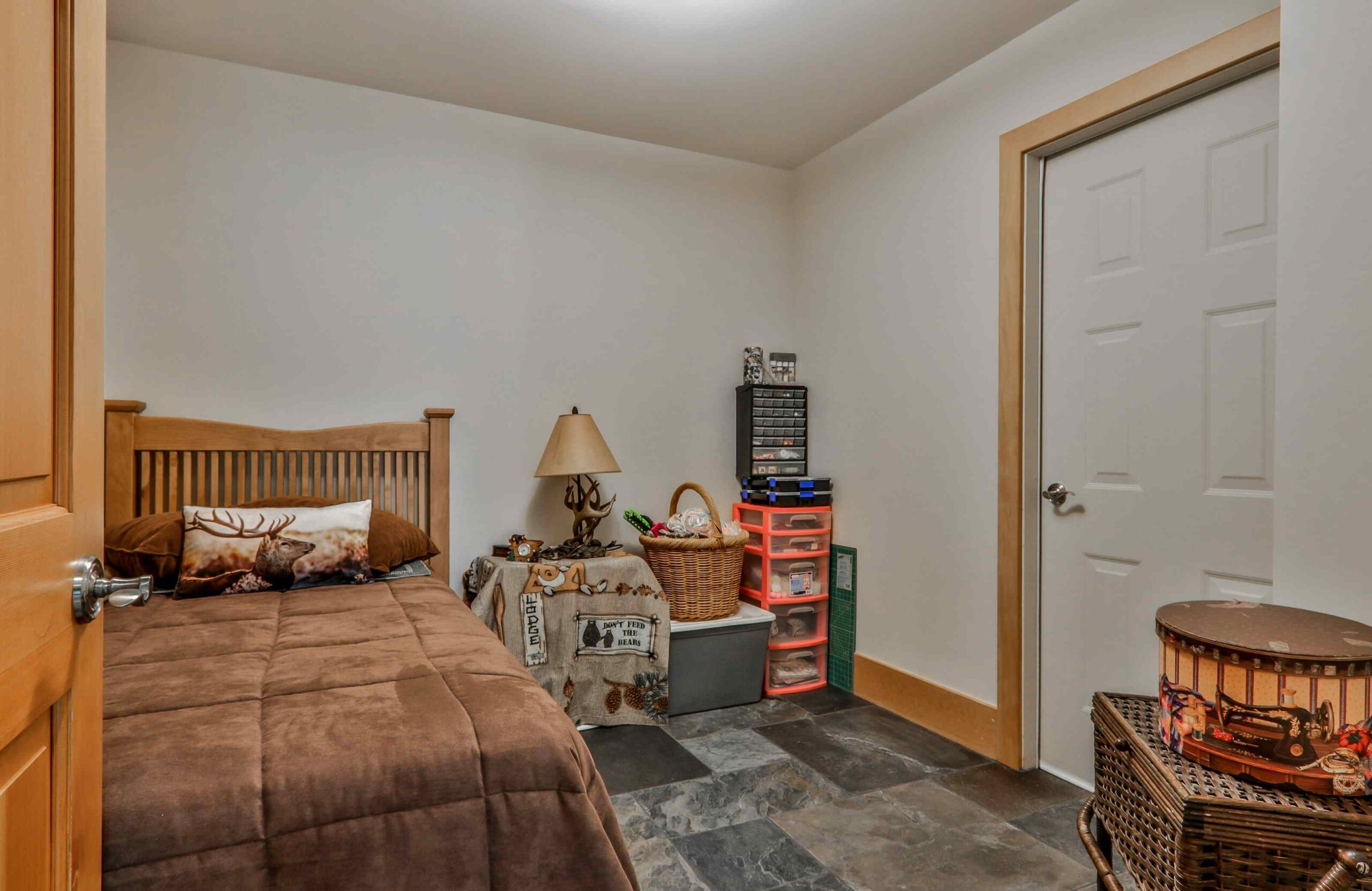 A bedroom with a bed and a closet.